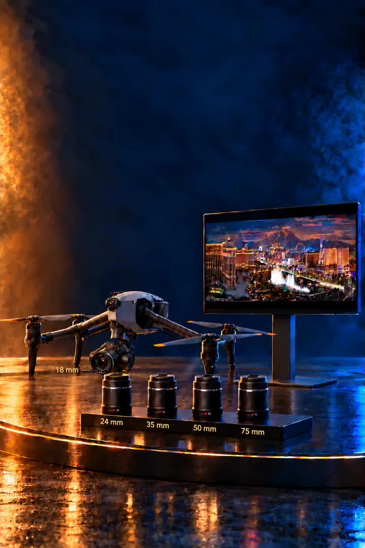 DJI Inspire 3 on a table with four spare prime lenses and a director’s monitor