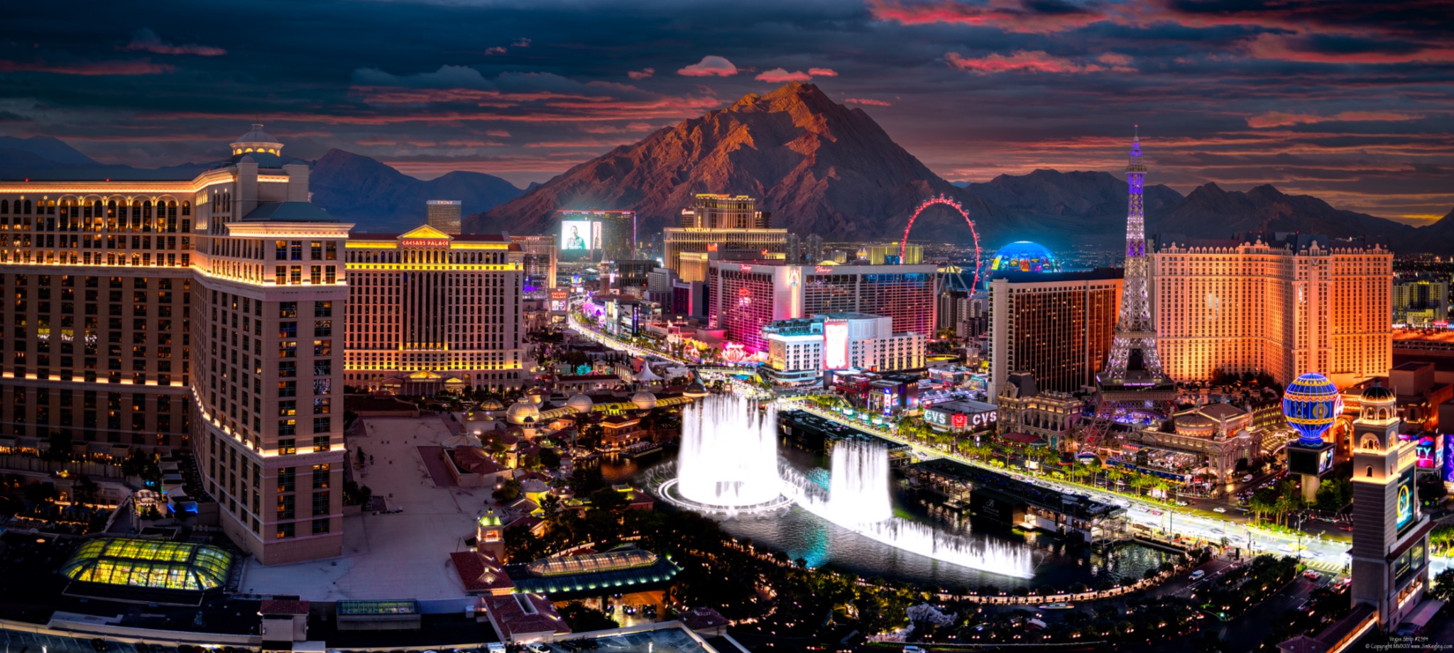The Las Vegas Strip and Bellagio fountains at dusk.